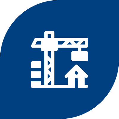 Crane and house icon on blue background.